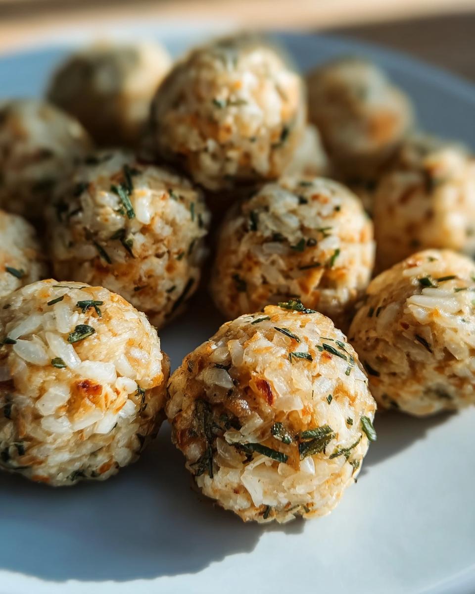 Close-up of several Amazing Chicken & Rice Energy Bites for dogs, made with rice and herbs.